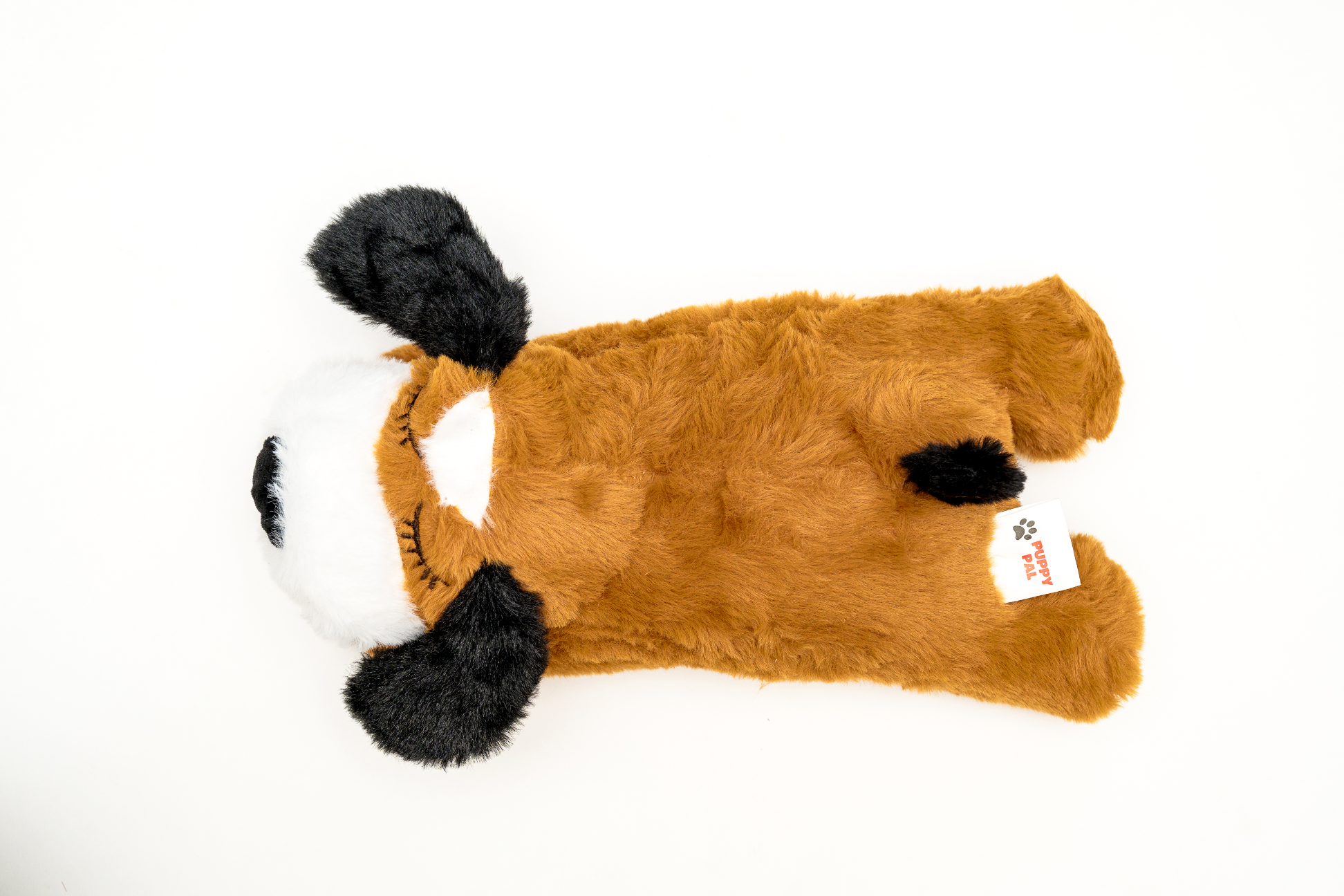 Single brown plush dog toy with black floppy ears and a white face, laid flat on a clean white background showcasing its full shape and texture.