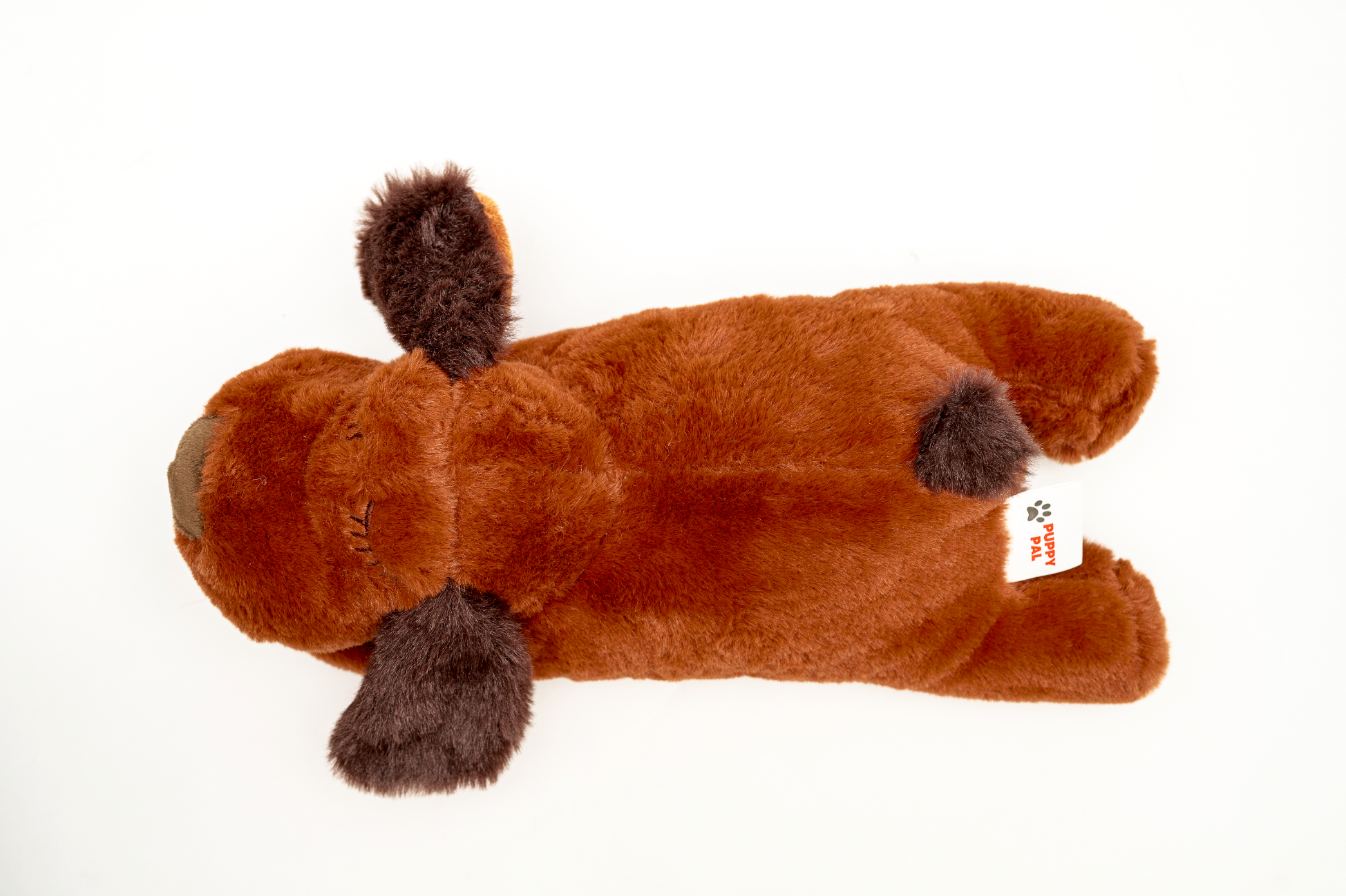 Single brown plush dog toy with dark brown ears and paws, laid flat on a white background to display its soft, fuzzy texture and playful shape.